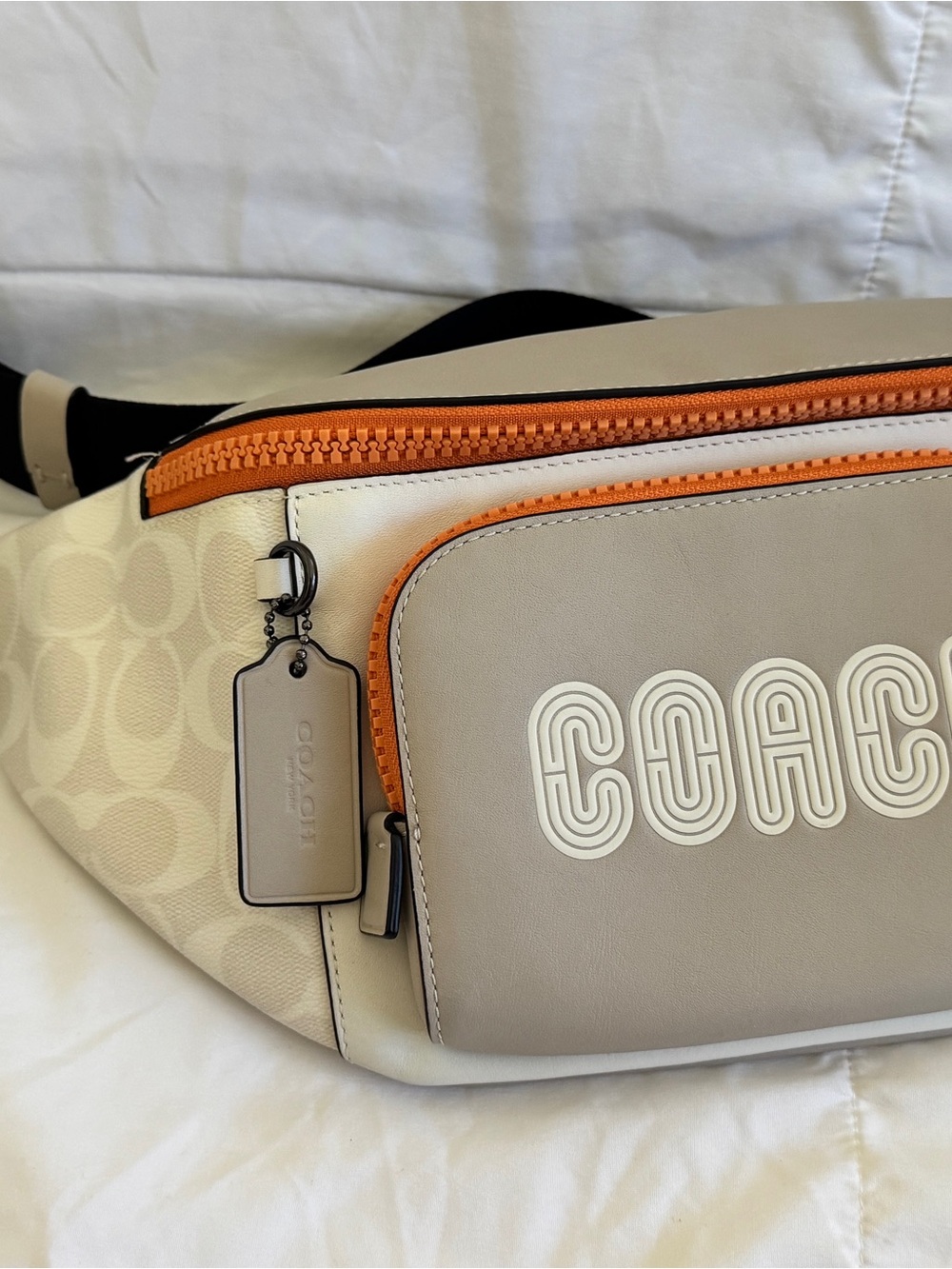 Coach Beige Pouch with Orange Zip Accent